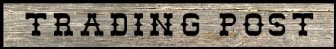 Wooden sign with 'Trading Post' text.