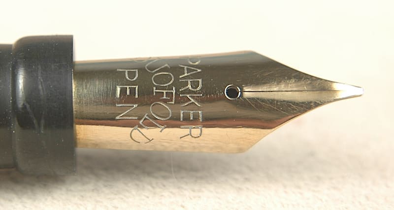 Fountain pen nib with engraved text.