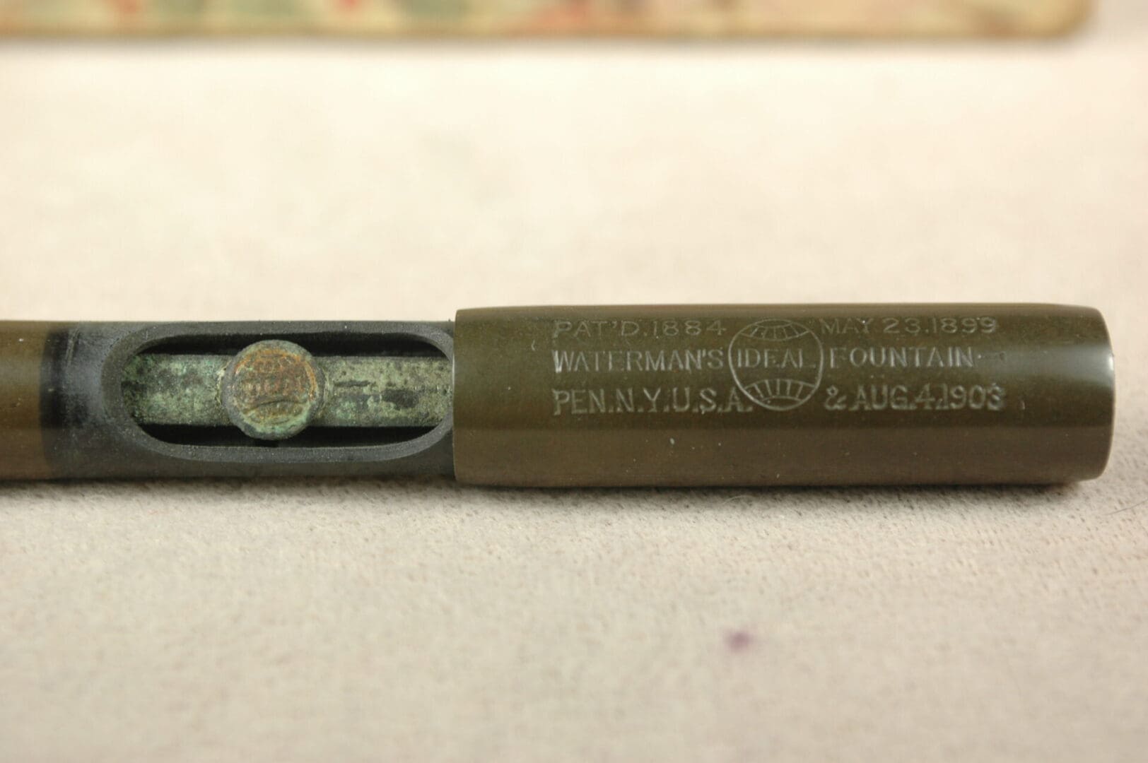 Vintage Waterman's fountain pen with engraved text.
