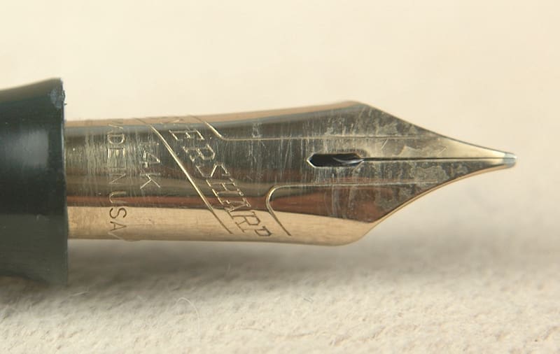 Gold fountain pen nib close-up.