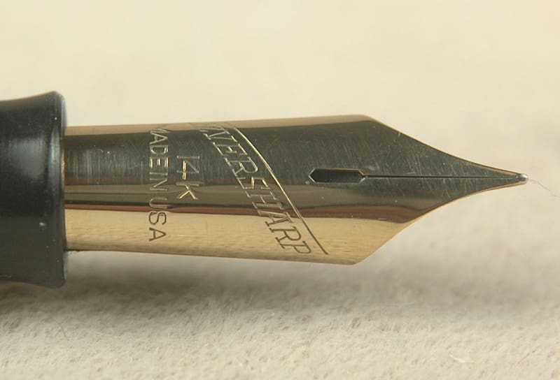 Gold fountain pen nib close-up.