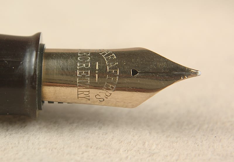 Fountain pen nib close-up, Sheaffer engraving.