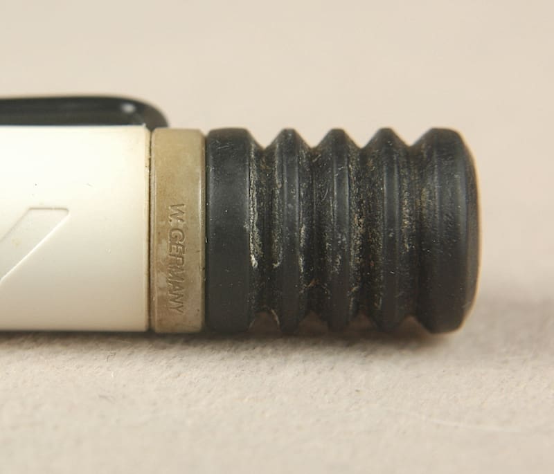 Black and white mechanical pencil eraser holder.
