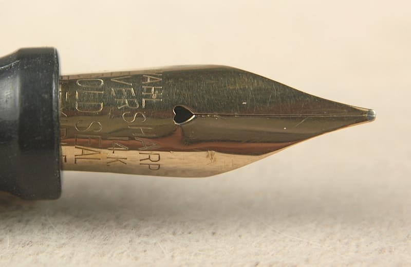 Close-up of a gold fountain pen nib.