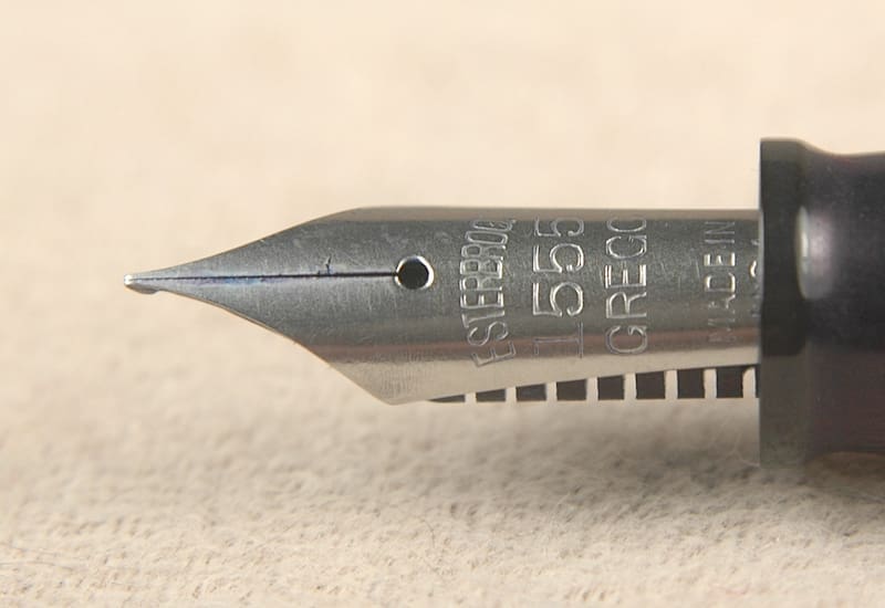 Fountain pen nib close-up on paper.