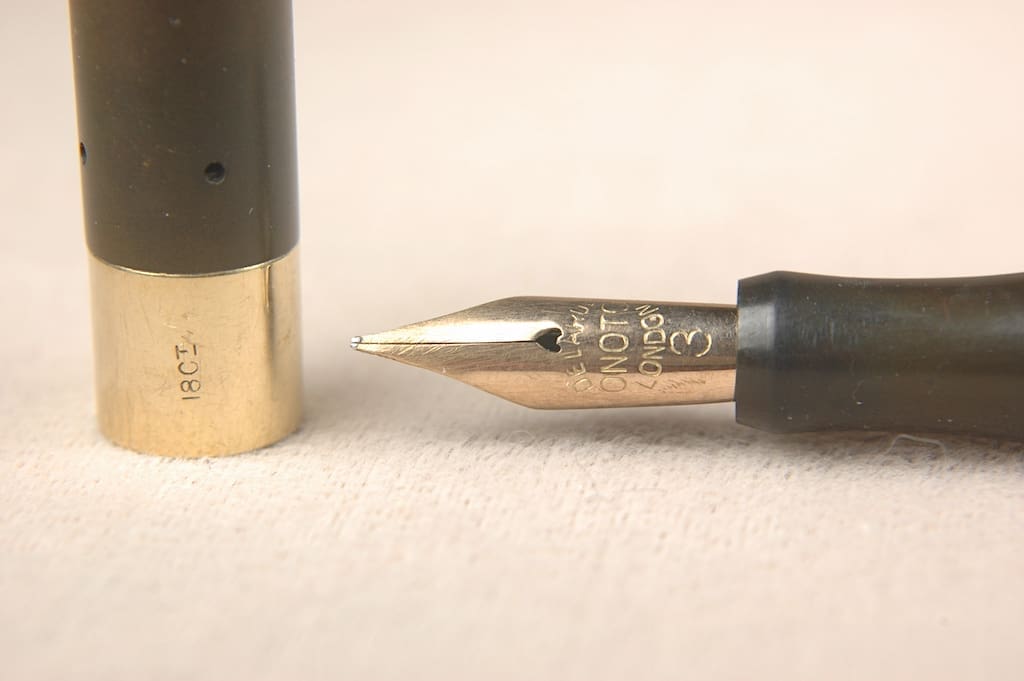 Fountain pen nib with cap close-up.