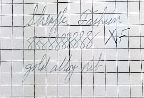 Handwritten practice of cursive letters and words on graph paper.