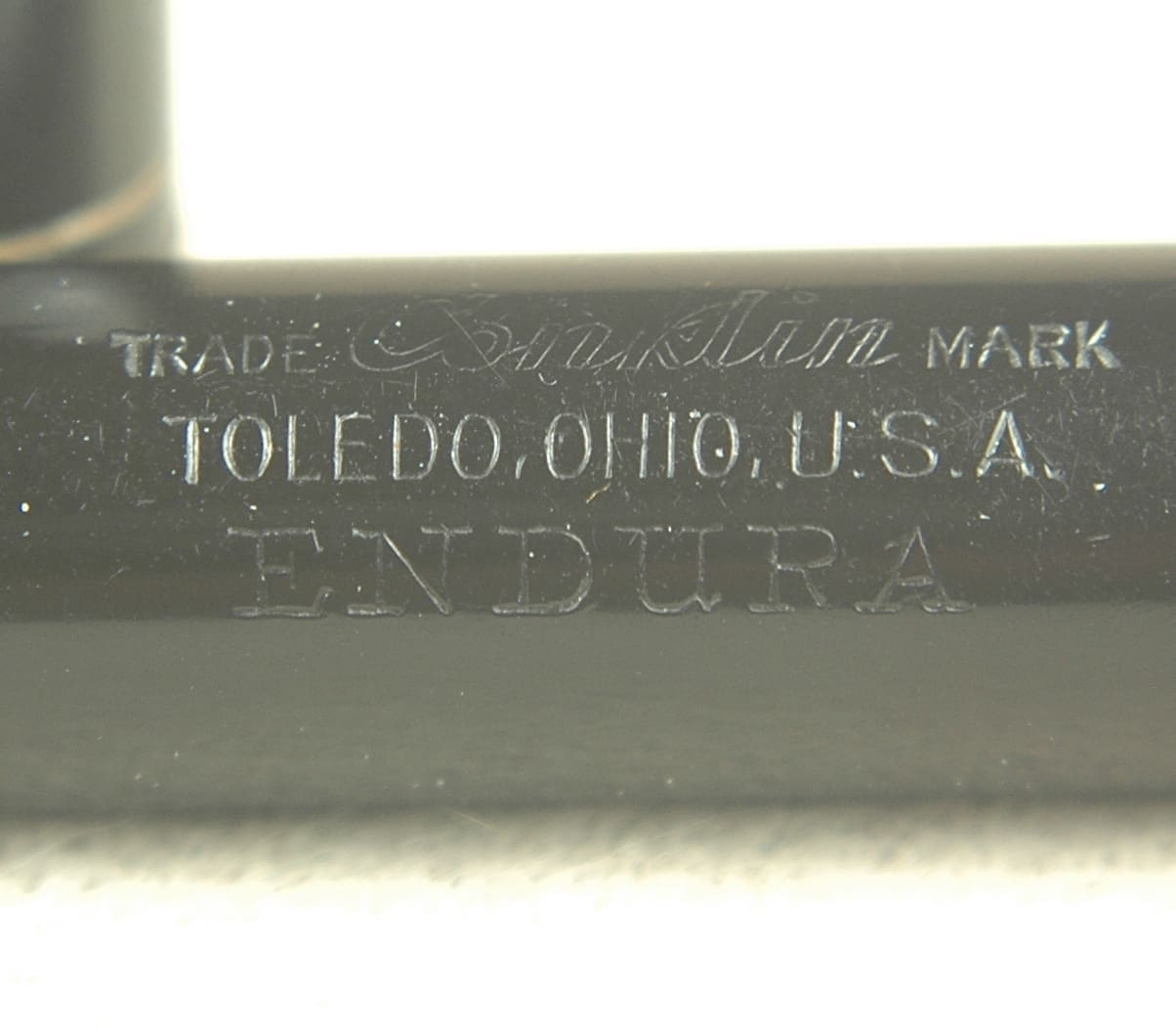 Endura inscription on black surface, Toledo, Ohio.