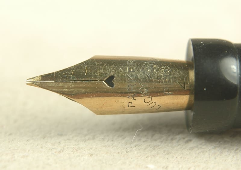 Gold fountain pen nib close-up.