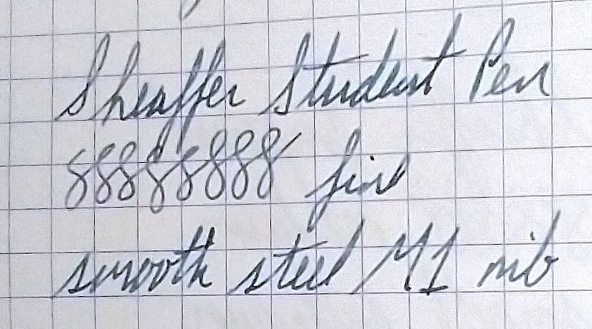 Close-up of cursive handwriting on lined paper.