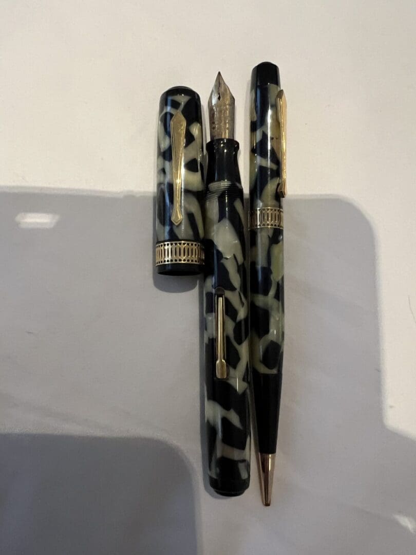 A stylish pen and its cap with a leopard print design.