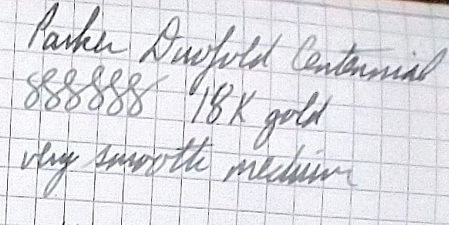 Close-up of handwritten notes on graph paper.