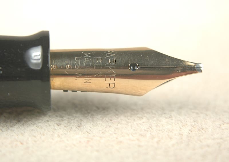 Close-up of a fountain pen nib with engraved details.