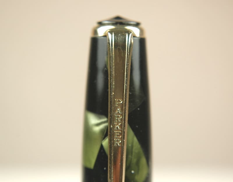 Close-up of a fountain pen nib with engraved brand name.