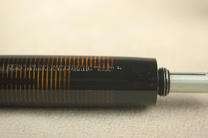 Close-up of a cylindrical electronic component with markings.