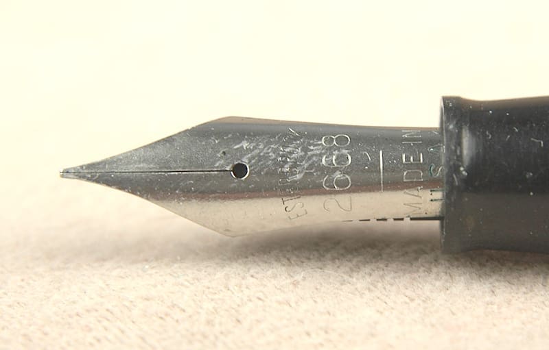 Close-up of a fountain pen nib with engraved details.