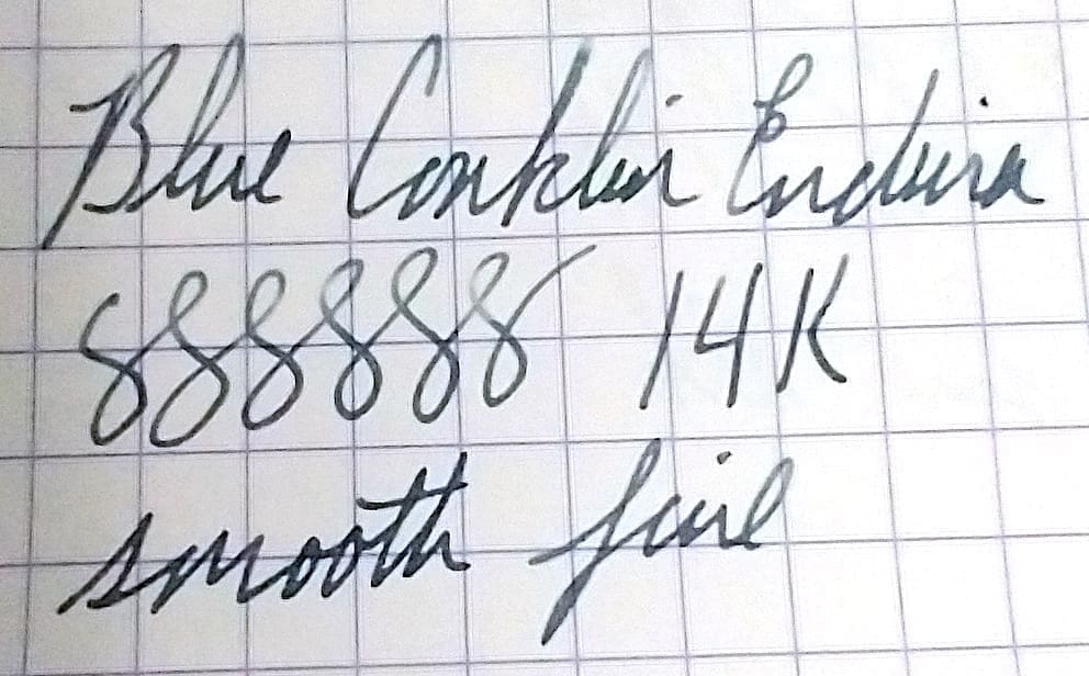 Handwritten notes on lined paper showing numbers and text.