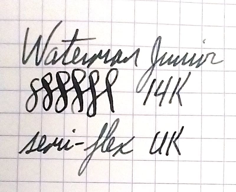 Handwritten fountain pen test on grid paper.