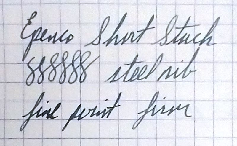 Close-up of handwritten text on graph paper.