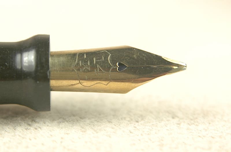 Close-up of a fountain pen nib with engraved details.