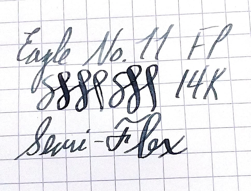 Handwritten text on graph paper with numbers and words.