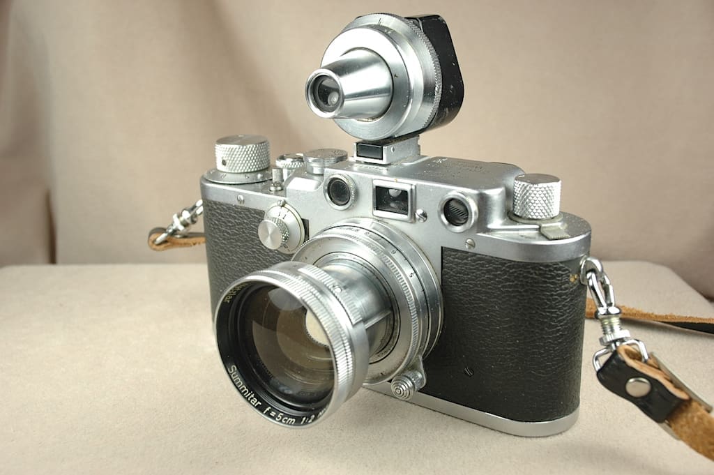 Vintage camera with a flash attachment.