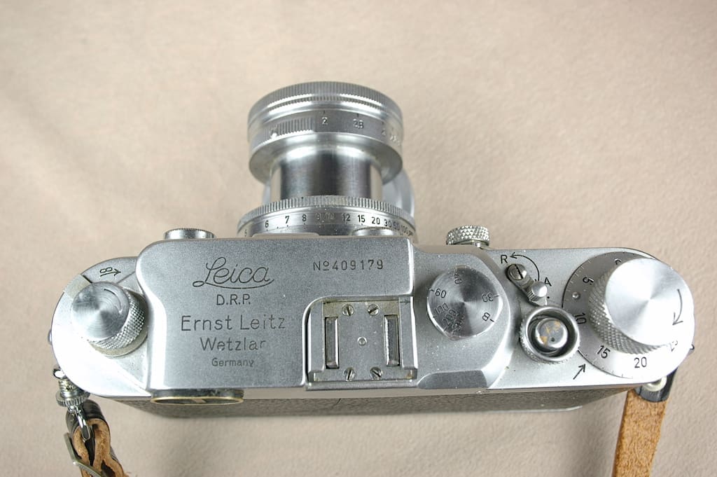 Top view of a vintage camera showing controls and markings.