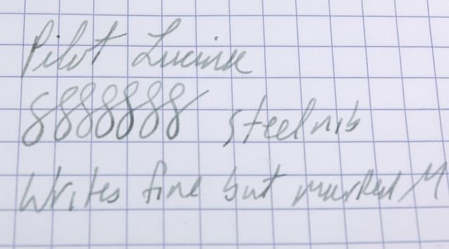 Handwritten notes on graph paper in cursive style.