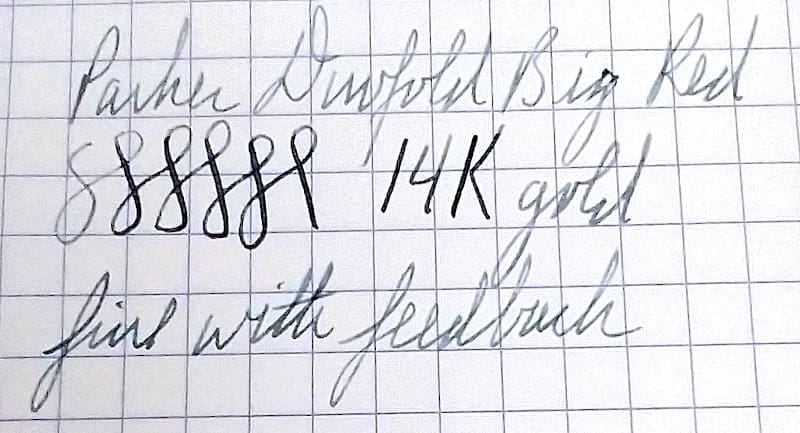 Handwritten text on graph paper with numbers and cursive writing.