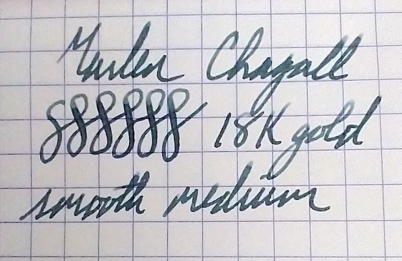 Handwritten text with numbers and cursive writing on graph paper.