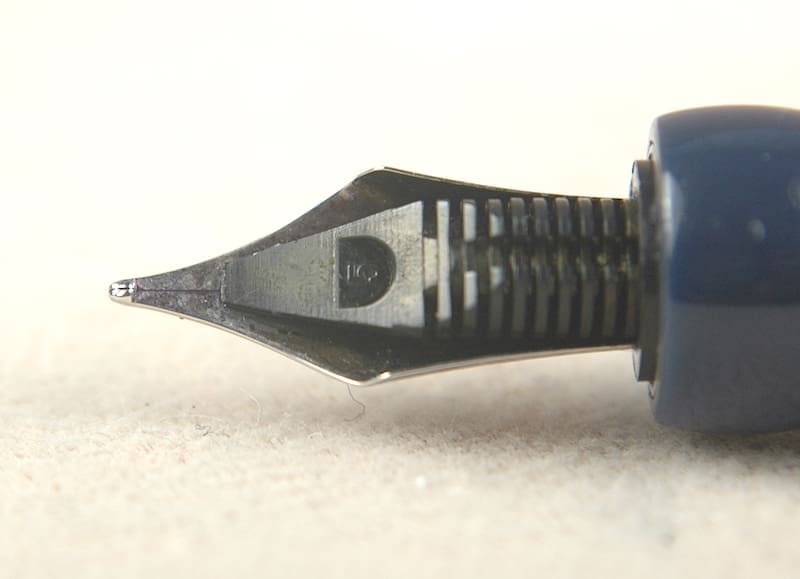 Close-up of a fountain pen nib with detailed engravings.