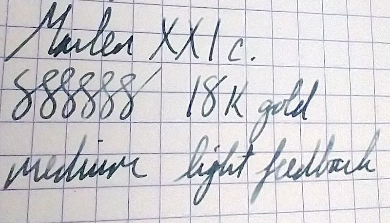 Close-up of handwritten notes on graph paper.