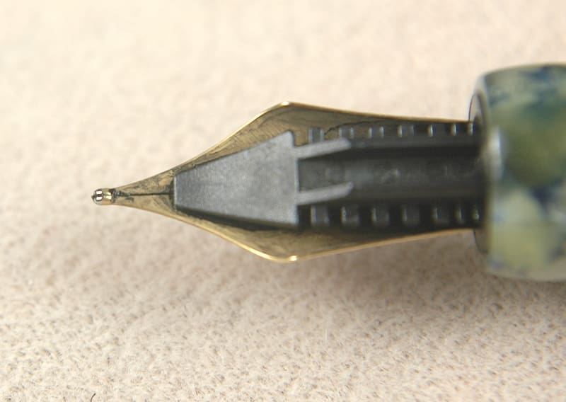 Close-up of a fountain pen nib with intricate details.