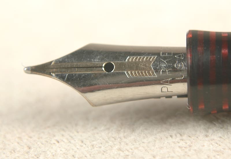 Close-up of a fountain pen nib with detailed engravings.