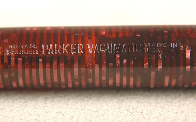 A close-up of a vintage Parker Vacumatic fountain pen barrel.