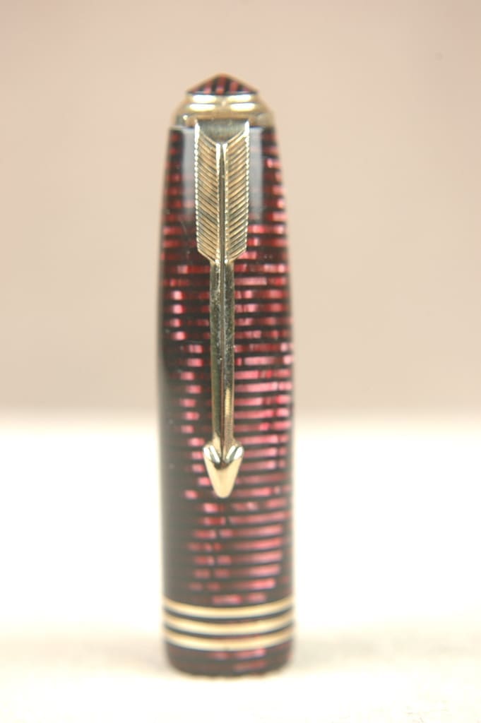 A decorative arrow with intricate details standing upright.