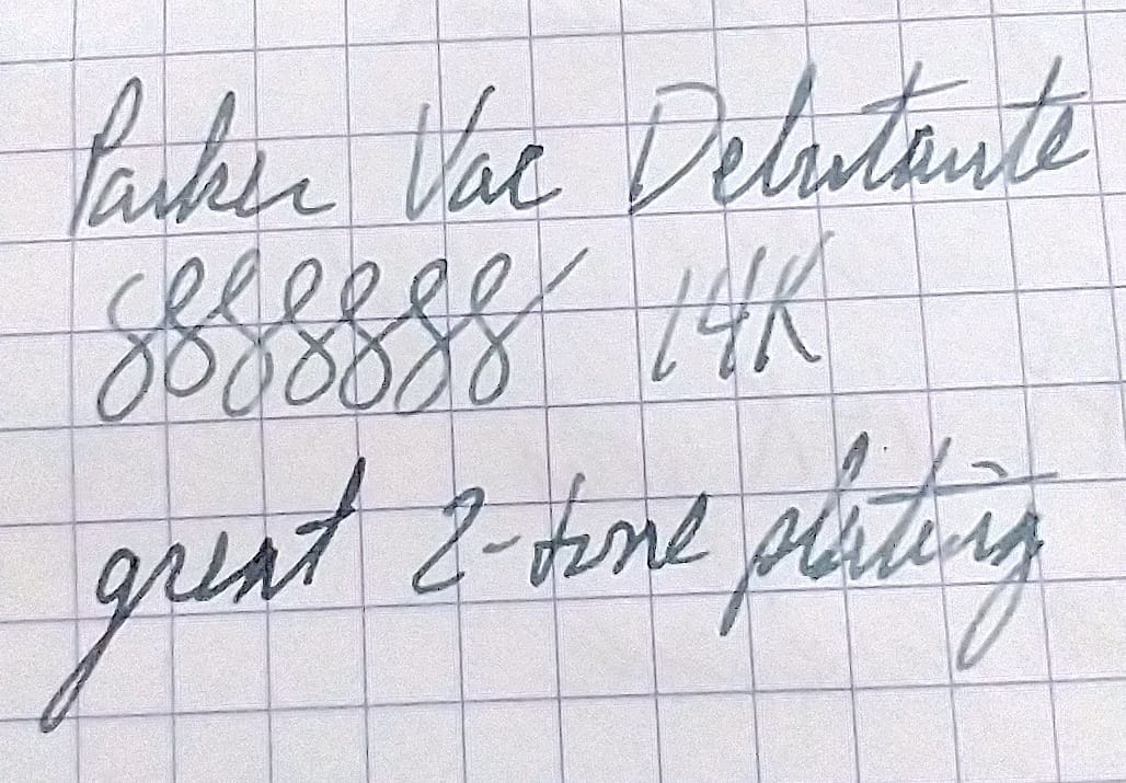 Close-up of handwritten notes on graph paper with numerical and textual details.